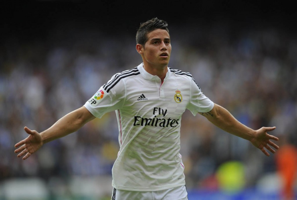 Real Madrid's Colombian midfielder James Rodriguez celebrates after scoring during the Spanish league football match RC Deportivo de la Coruna vs Real Madrid CF at the Municipal de Riazor stadium in La Coruna on September 20, 2014. AFP PHOTO/ MIGUEL RIOPAMIGUEL RIOPA/AFP/Getty Images ORG XMIT: 504076097 ORIG FILE ID: 533600238