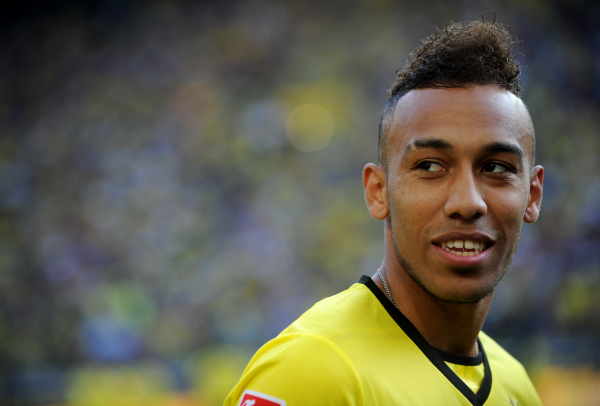 Dortmund's Pierre-Emerick Aubameyang walks across the pitch prior to the test match between Bundesliga soccer club Bosussia Dortmund and the team of SAT.1-Helden at the Signal-Iduna-Park soccer stadium in Dortmund, Germany, 6 July 2013. The Bundesliga team officially opened the 2013/2014 - Photo: Jonas Guettler / PICTURE ALLIANCE / DPPI